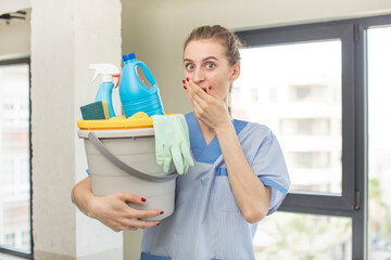 covering mouth with a hand and shocked or surprised expression. housekeeper concept