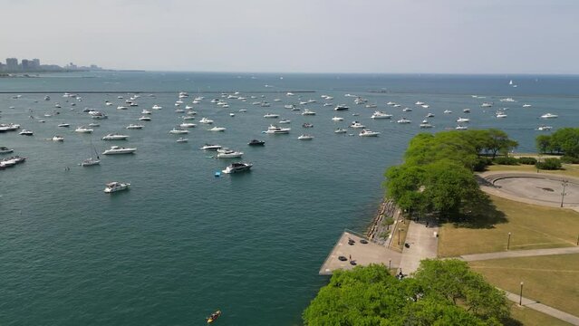 Drone Footage Of Chicago Skyline And Lakefront With Busy Traffic And Boats On A Warm Summer Day