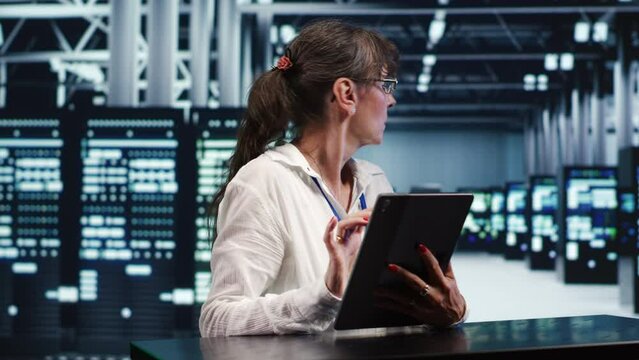 Cloud computing business executive working in data center housing GPU dedicated servers that can process AI tasks with high efficiency, investigating rigs used for machine learning showing pitfalls