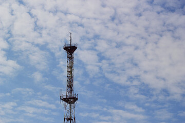 Photo of television tower against blue sky and