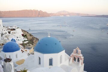Blue dome roof in an orthodox church on a beautiful landscape in the bay of Santorini, Greece,...