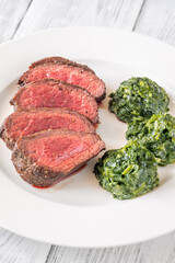 Flank steak with creamy spinach