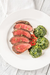 Flank steak with creamy spinach