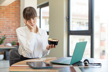 young pretty woman feeling bored, frustrated and sleepy after a tiresome. ramen  bowl concept
