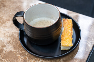 Truffle mushroom soup in a cup with bread