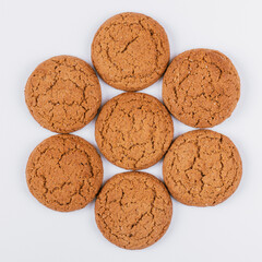 Sweet tasty oatmeal cookies on white background. Top view.