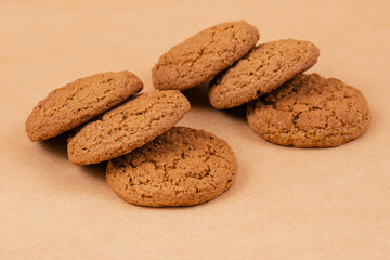 Oatmeal cookies on beige background.