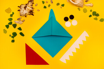 Making Origami paper bookmark baby shark from colored paper. Children's art project. DIY concept. Step by step photo instruction