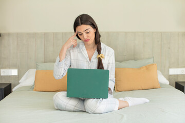 pretty young model looking surprised, realizing a new thought, idea or concept. rest and nightwear concept