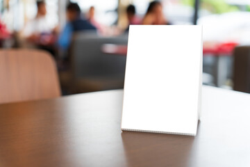 Menu mock up blank for text marketing promotion. Mock up Menu frame standing on wood table in restaurant space for text.