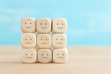 Top view image of table with note of happy and sad face. concept of happiness emotion and satisfaction