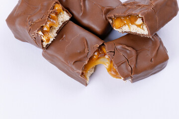 Sweet chocolate bars broken into two pieces. Top view.