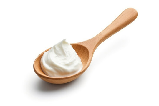 Sour cream in the wooden spoon isolated on white background.Generative Ai.
