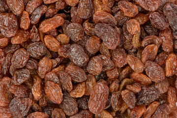 Full frame of dehydrated sweet raisins. Raisins as background.