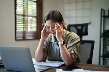 Tired asian woman overworking and headache stressed, Chronic migraine..