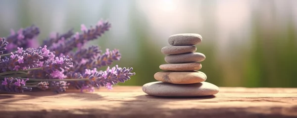  Stones and lavenders on wooden desk on background of lavender field. Spa still life in pastel colors. Copy space © Yeti Studio