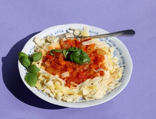pasta ,tomato sauce and meat goulash as tasty lunch meal