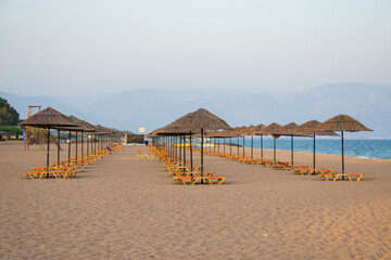 Lines of sun beds on a tourist resort in Messini, Greece