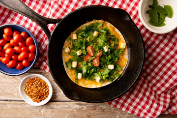 Cheesy Arugula Pizza with Cherry Tomatoes in Cast Iron Skillet