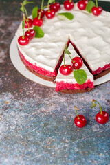 Cherry cake decorated with fresh cherries
