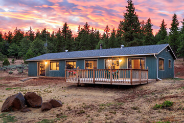 Passive Solar Home At Twilight In The Trees - 634812799