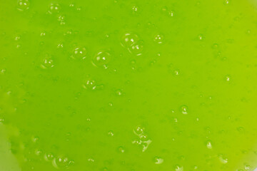 Green slime toy as a background.