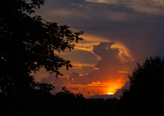 Sunset with man in the clouds.