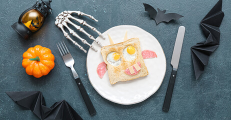 Funny Halloween food for kids on dark background