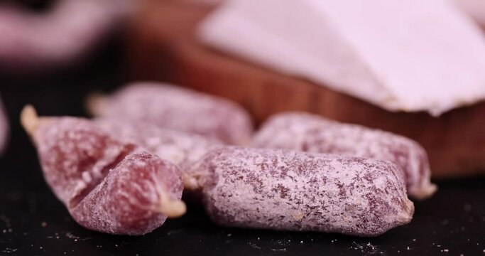 small salami sausages with white mold, dry food meat with white mold
