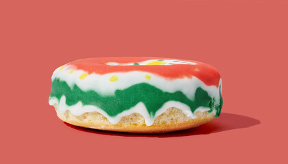 Donut with glaze on pink pastel background