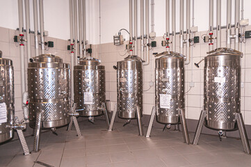   Front view, medium distance of, a group of, stainless steel, wine, fermentation tanks french wine,cellar