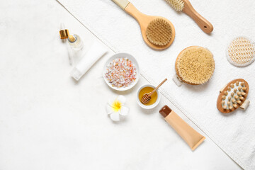 Composition with spa supplies and cosmetics on light background