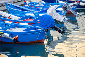 Fototapeta na wymiar Fishing boats in the harbor of Matera, Puglia, Italy