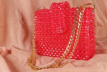 Handmade fuchsia pink purse bag made with beads on pink fabric with gold handle. 