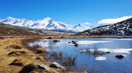 Fototapeta na wymiar a mountain range with a lake surrounded by snow covered mountains. generative ai
