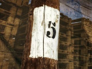 numeral five, black number five on a white background, number on a column, dense mesh as a background