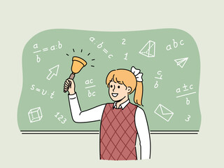 Girl elementary school student with bell stands near chalkboard with mathematical formulas and examples. Happy schoolgirl with bow on blond hair makes call, for concept back to school - obrazy, fototapety, plakaty