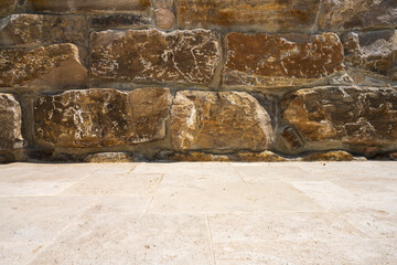 Fragment of a natural stone wall as a background or texture. The structure of the stone wall. Old castle stone wall texture background. Мasonry background