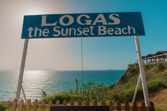 Logas the sunset beach signboard in front of ocean