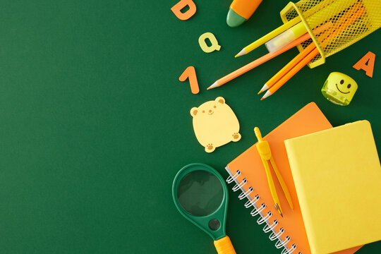 Joyfully experiencing education as young learners. Top view photo of educational tools, colorful numbers on green background with empty space for advert or message - Powered by Adobe