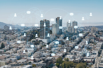 Panoramic cityscape view of San Francisco financial downtown at day time from rooftop, California, United States. Social media hologram. Concept of networking and establishing new people connections