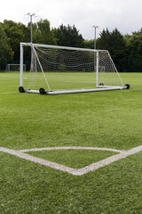 Naklejka premium A empty goal posts in a empty football pitch 