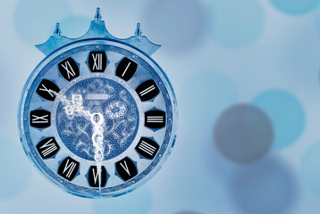 Old vintage clock face with a blue background