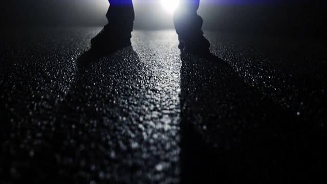 Silhouette of  Man Standing on Street at Night