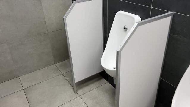 Row of urinals in a public men's room