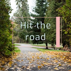 Composite of hit the road text over path and trees in autumn park