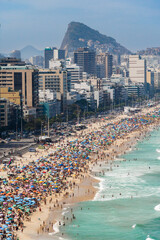 Leblon and Ipanema beach in Rio de Janeiro, Brazil. Sunny day with blue sky and many people on the...