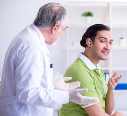 Male patient with hearing problem visiting doctor otorhinolaryng