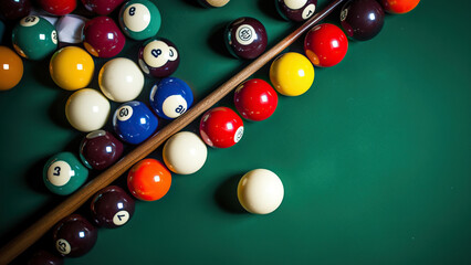 Pool balls and cue on pool table, top view