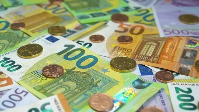 Euro banknotes of various denominations and Euro cents. Real euro banknotes and metal coins of various colors, size and nominals. Banknotes 500, 200, 100 and 50 Euro